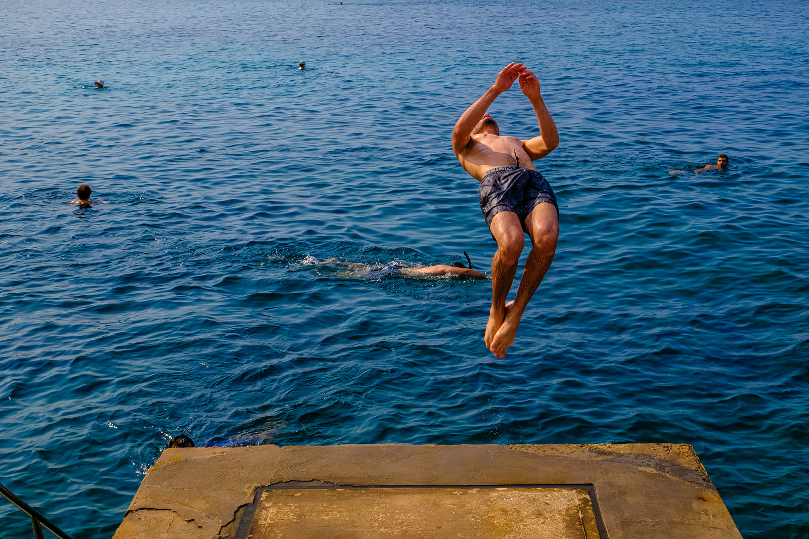 Capturing a man jumping in the sae with the Fuji X100VI